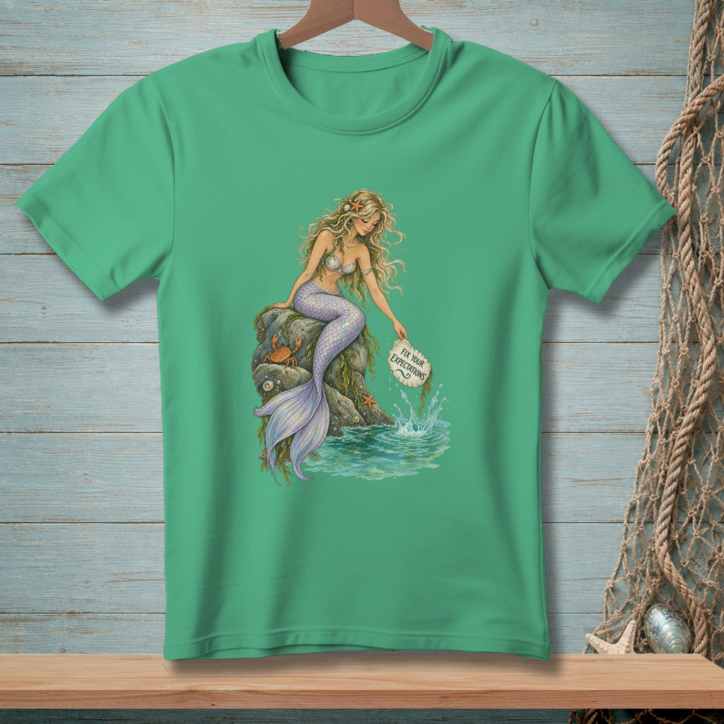 Mermaid holding sign that says "Fix Your Expectations".