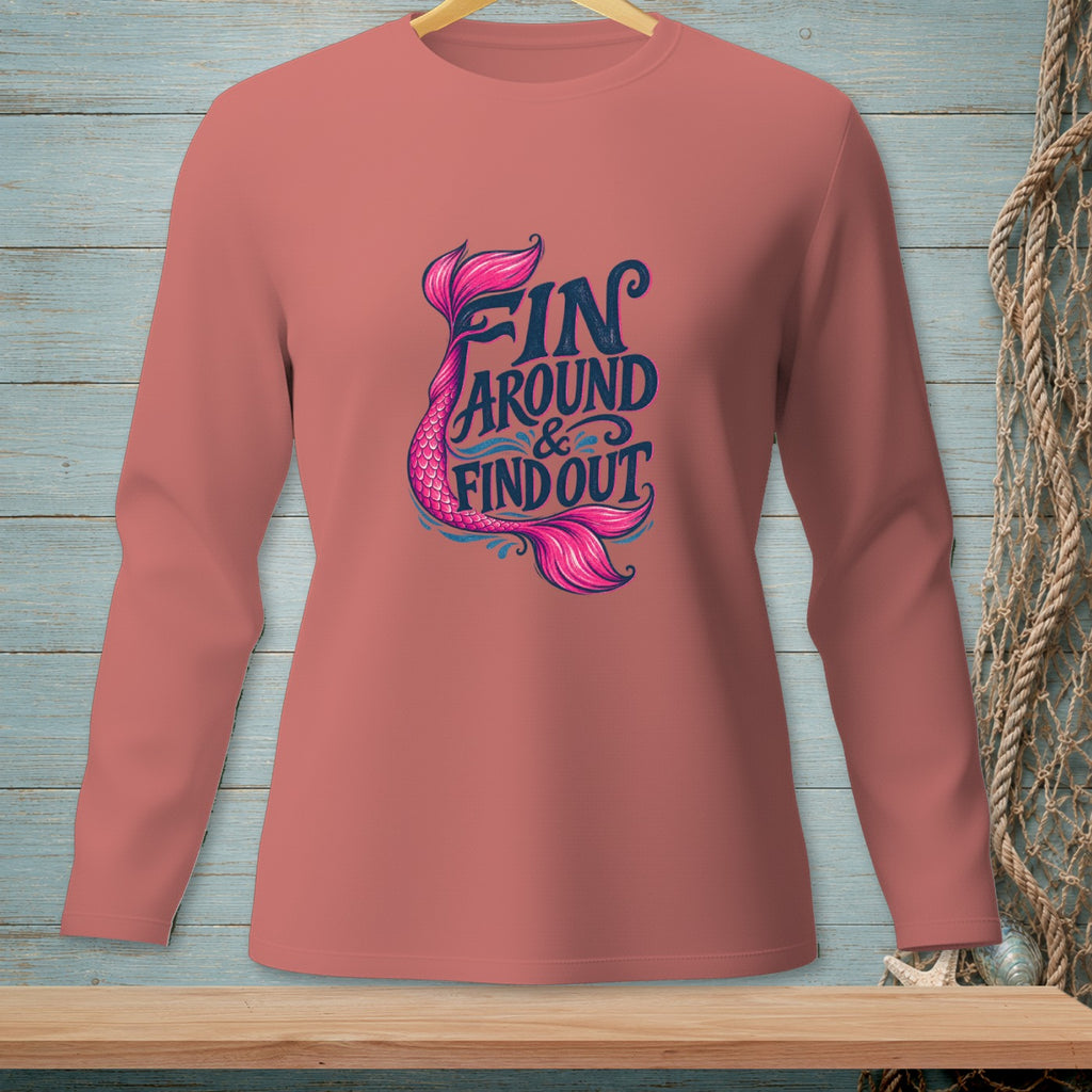 Pink long-sleeve shirt with "Fin Around & Find Out" mermaid tail graphic.