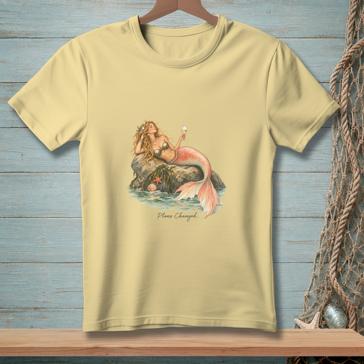 Light yellow t-shirt with a mermaid holding an ice cream cone and text "Plans Changed."