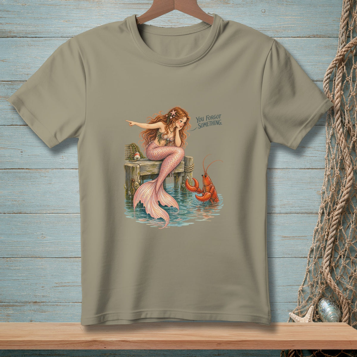 Mermaid on dock points to lobster with text "You forgot something."