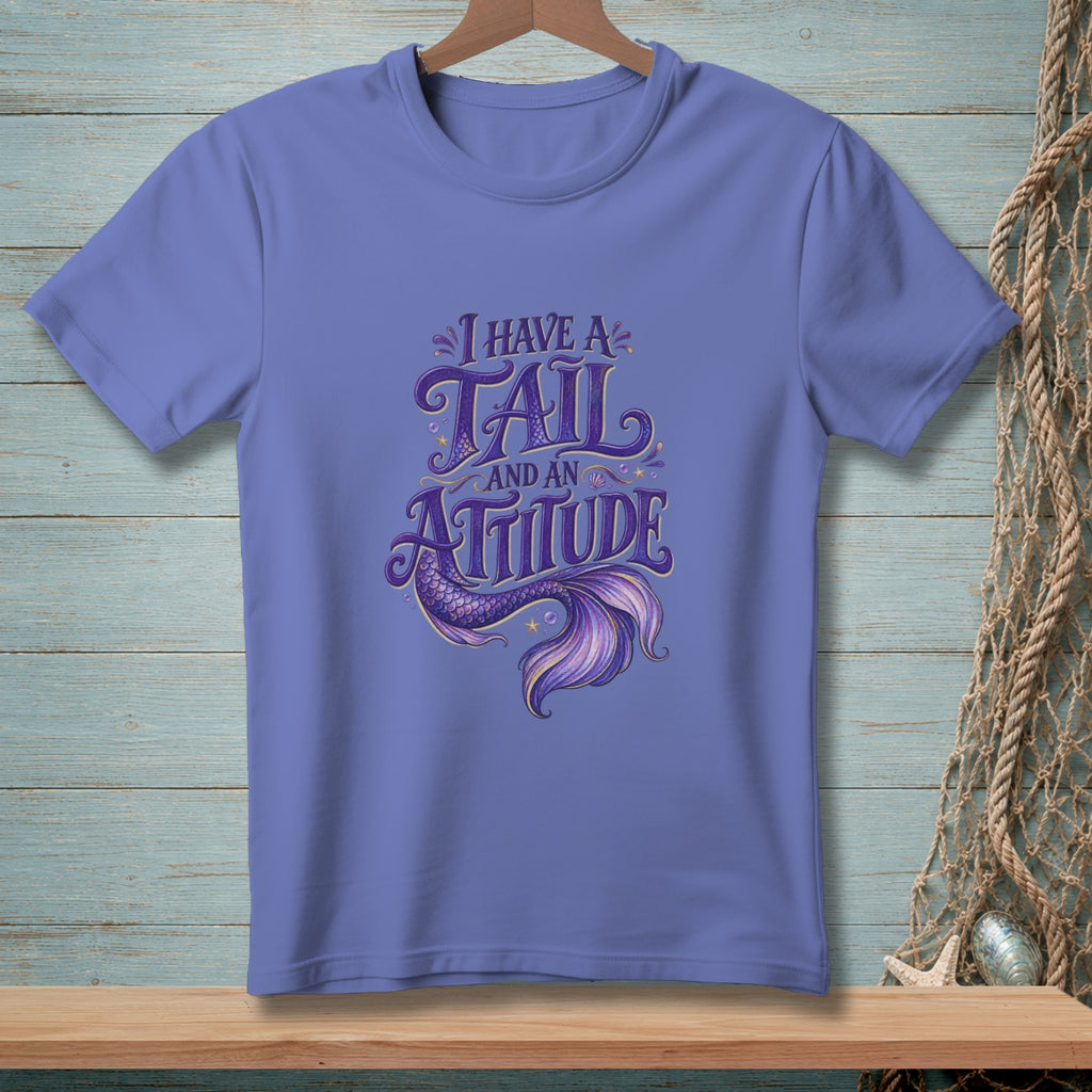 Purple t-shirt with "I have a tail and an attitude" mermaid graphic.