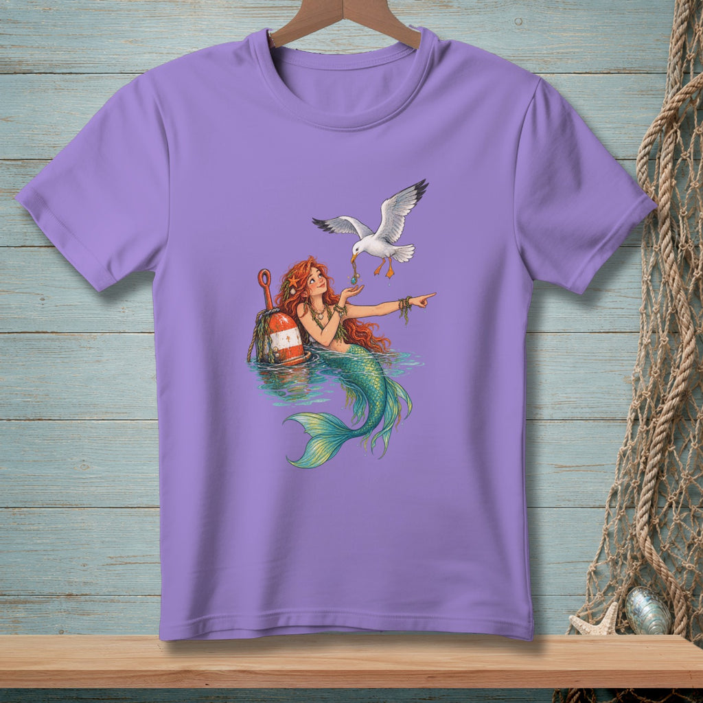 Purple t-shirt with a mermaid feeding a seagull next to a buoy.