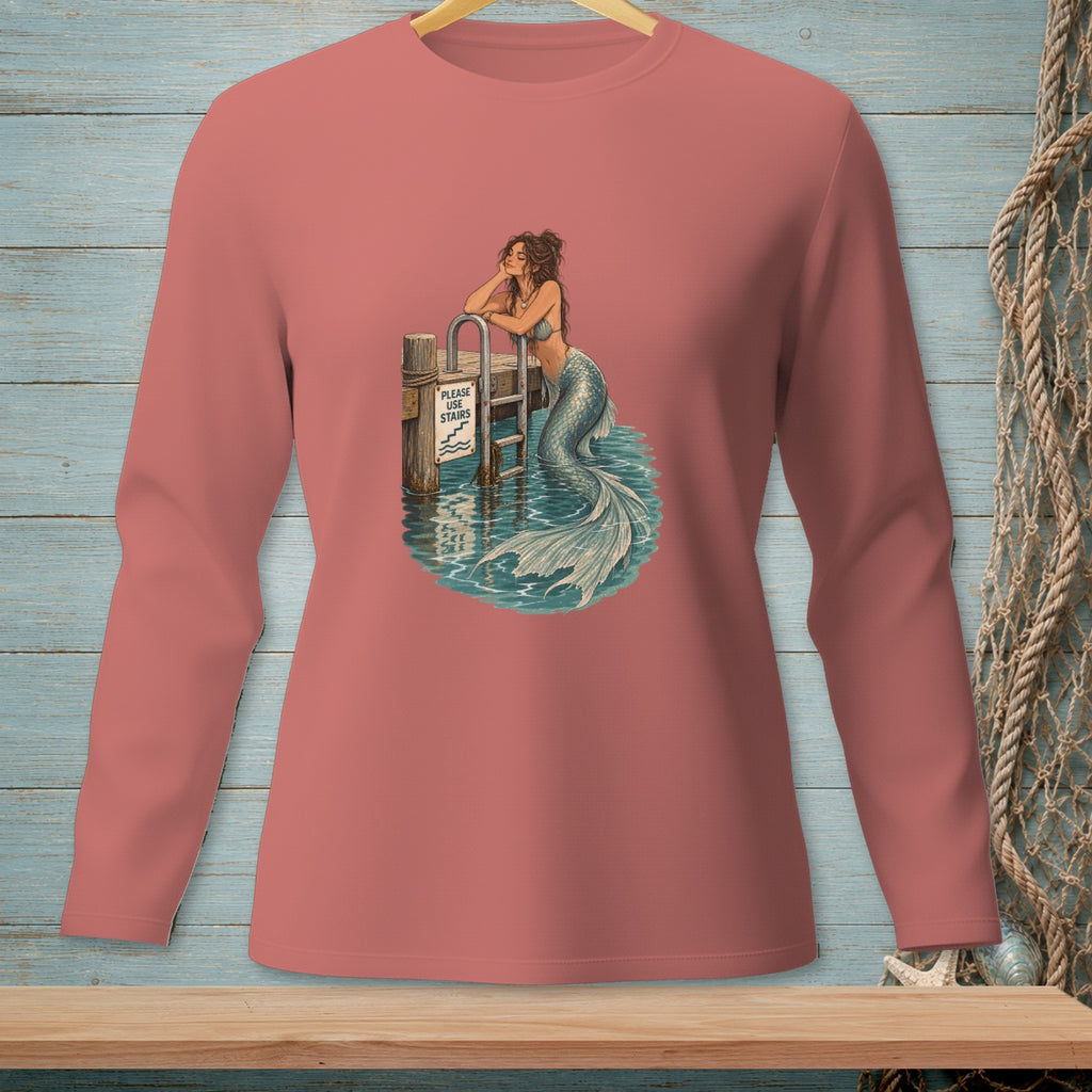 Mermaid resting on dock post with "Please Use Stairs" sign and ladder.