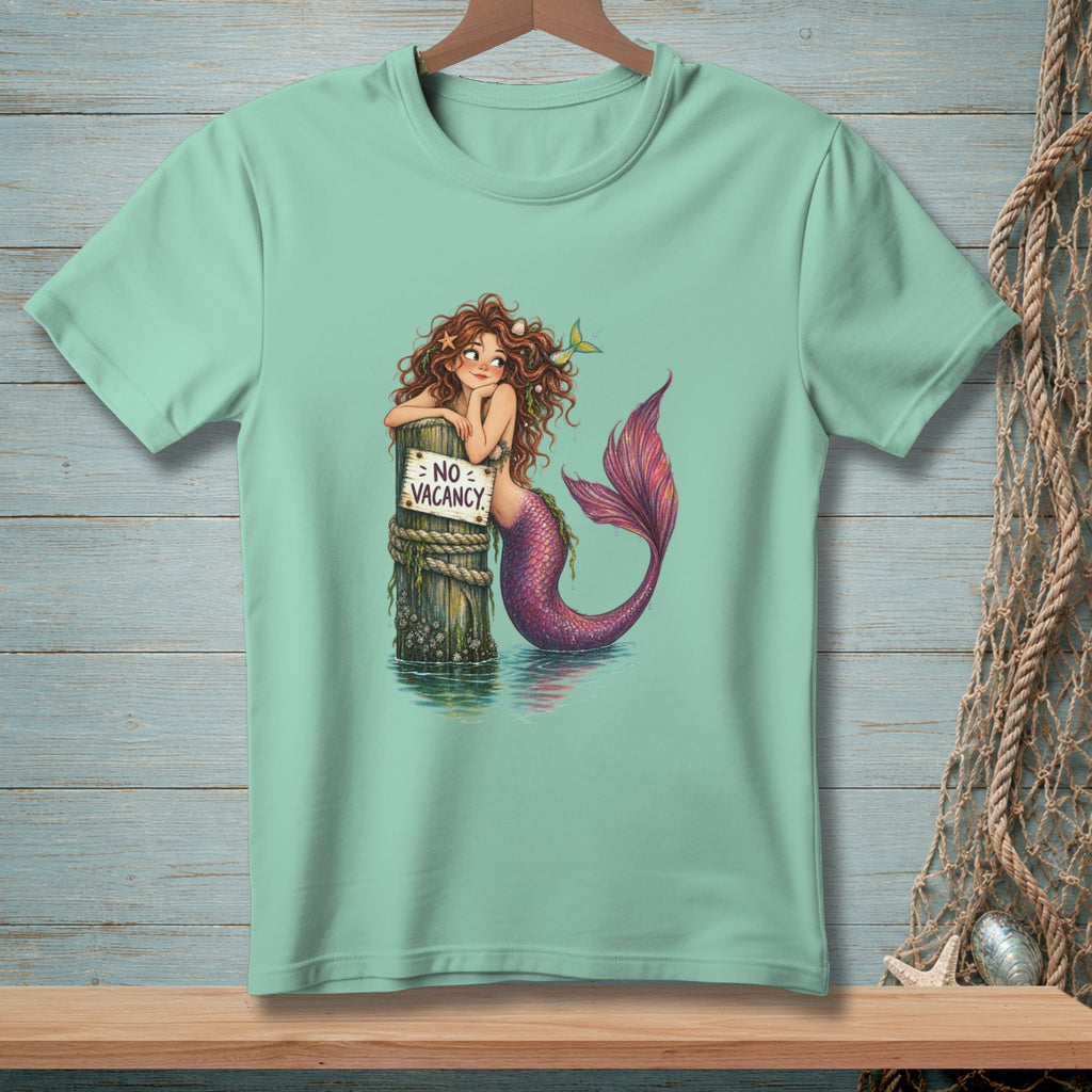 Mermaid leaning on post with "NO VACANCY" sign in the water.