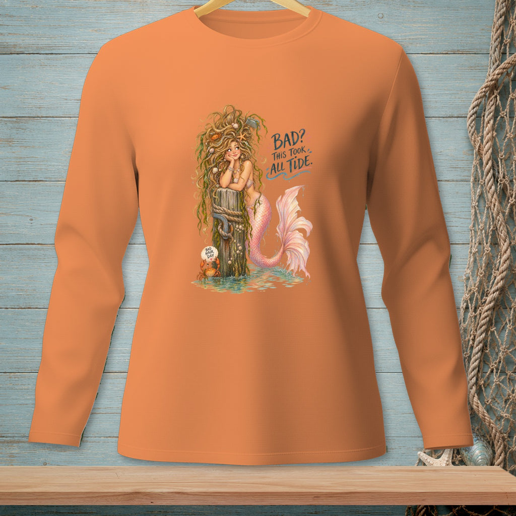 Orange long-sleeve shirt with a mermaid graphic that reads "Bad? This took all tide."