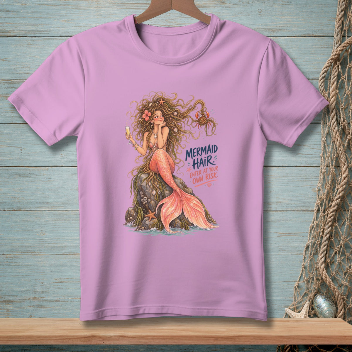 Pink t-shirt with a mermaid graphic and text "Mermaid Hair: Enter at Your Own Risk."