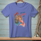 Mermaid with lobster on post, "Keep your claws on" text, purple t-shirt.