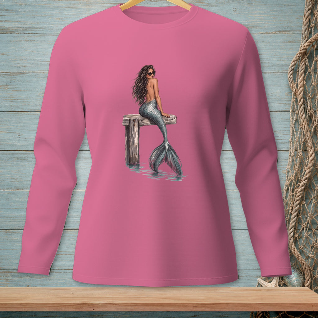 Pink long sleeve shirt with mermaid and "YOU AGAIN?" text on wooden dock.