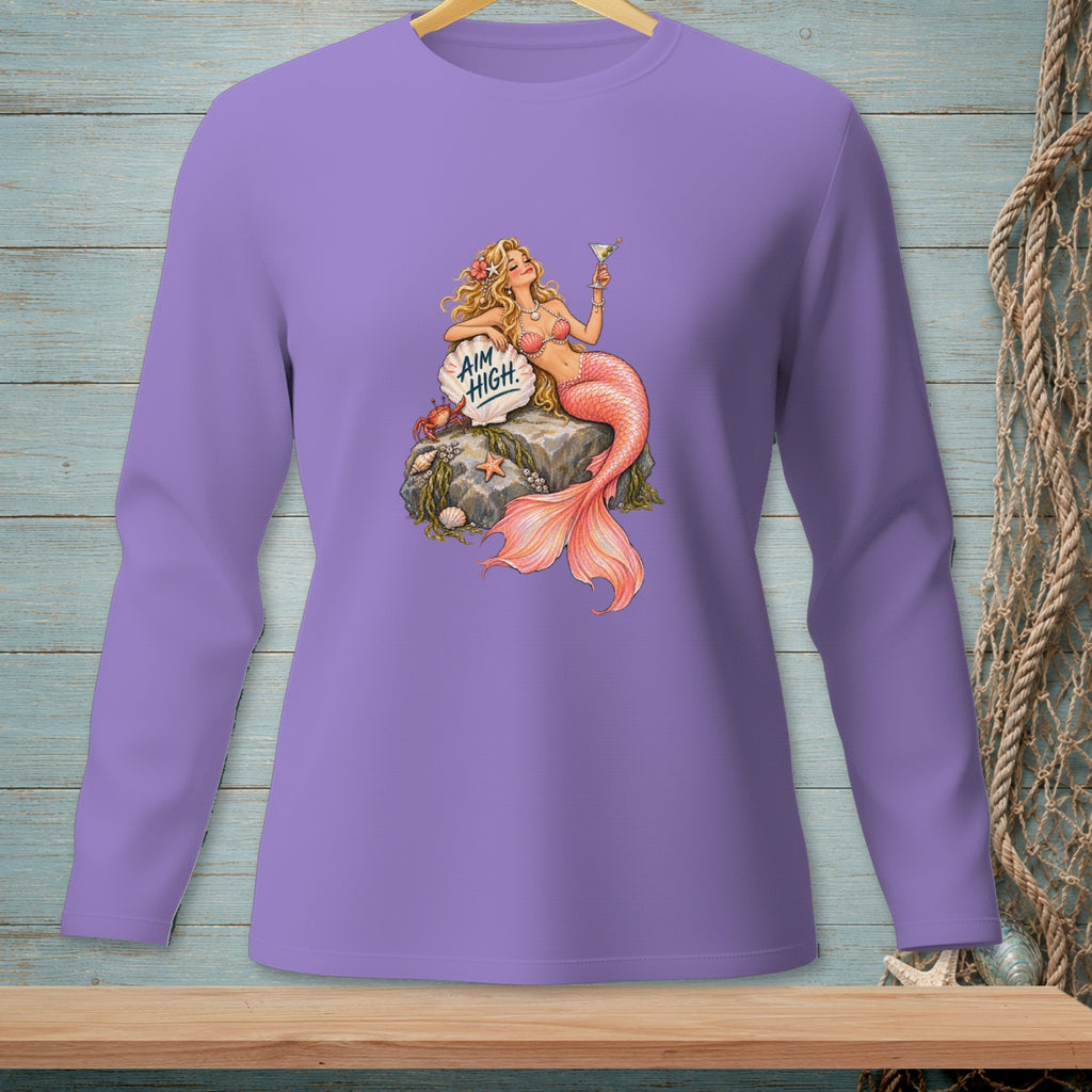 Mermaid with cocktail on rock, text "AIM HIGH" on shell, on purple long sleeve shirt.