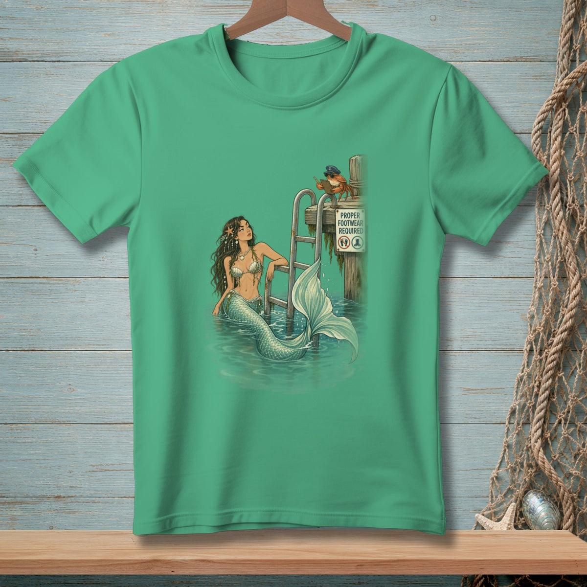 Mermaid near ladder with crab and "Proper Footwear Required" sign.