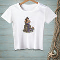 White t-shirt with illustration of a mermaid on rocks holding a crab.