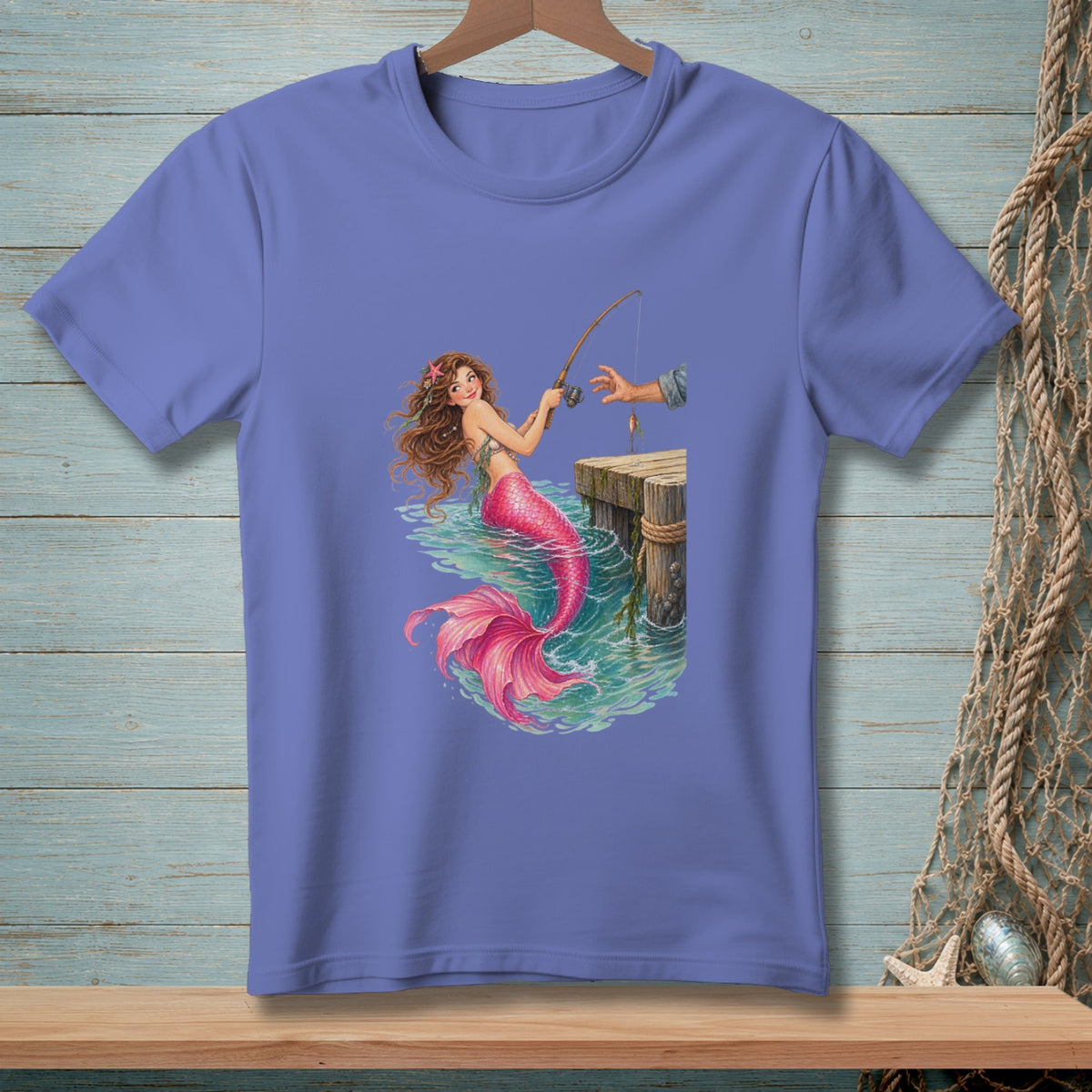 Mermaid fishing from a dock with a fishing pole, wearing a pink tail.