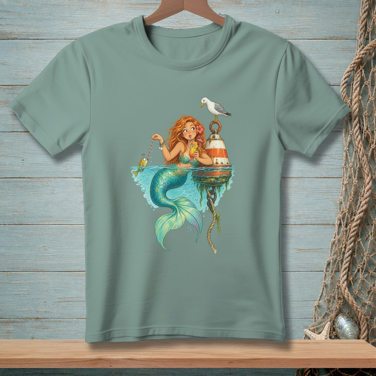Mermaid with red hair fishing with a cocktail and a seagull on a buoy.