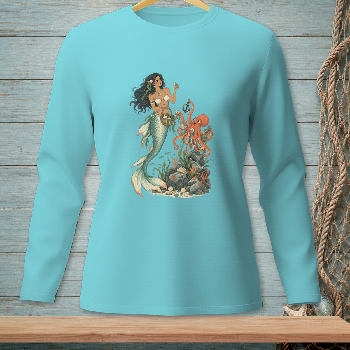 Light blue long-sleeve shirt with a mermaid and octopus under the sea graphic.