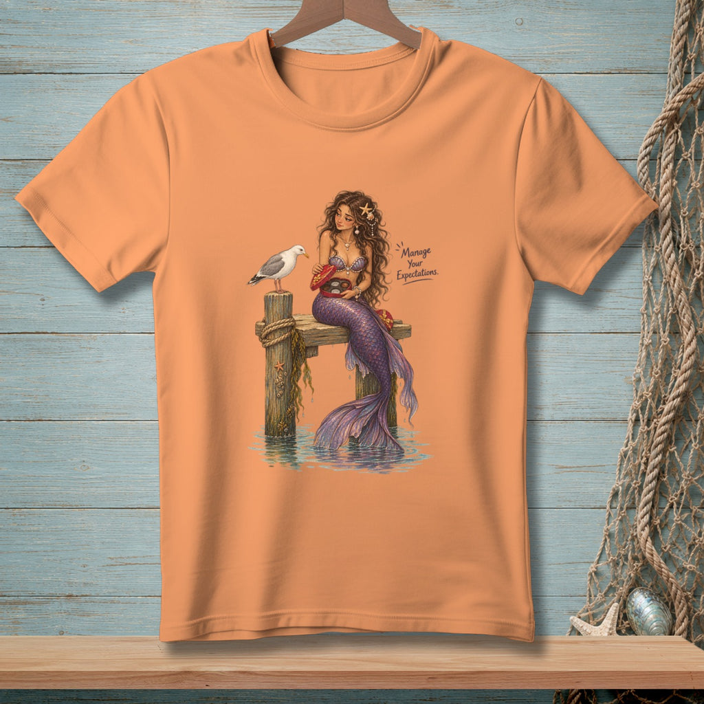 Mermaid with chocolates and seagull on dock with text "Manage Your Expectations."