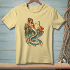 Yellow t-shirt featuring a mermaid and octopus design with oceanic elements.