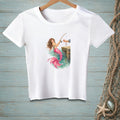 White t-shirt with a graphic of a mermaid fishing from a dock.