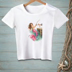 White t-shirt with a graphic of a mermaid fishing from a dock.