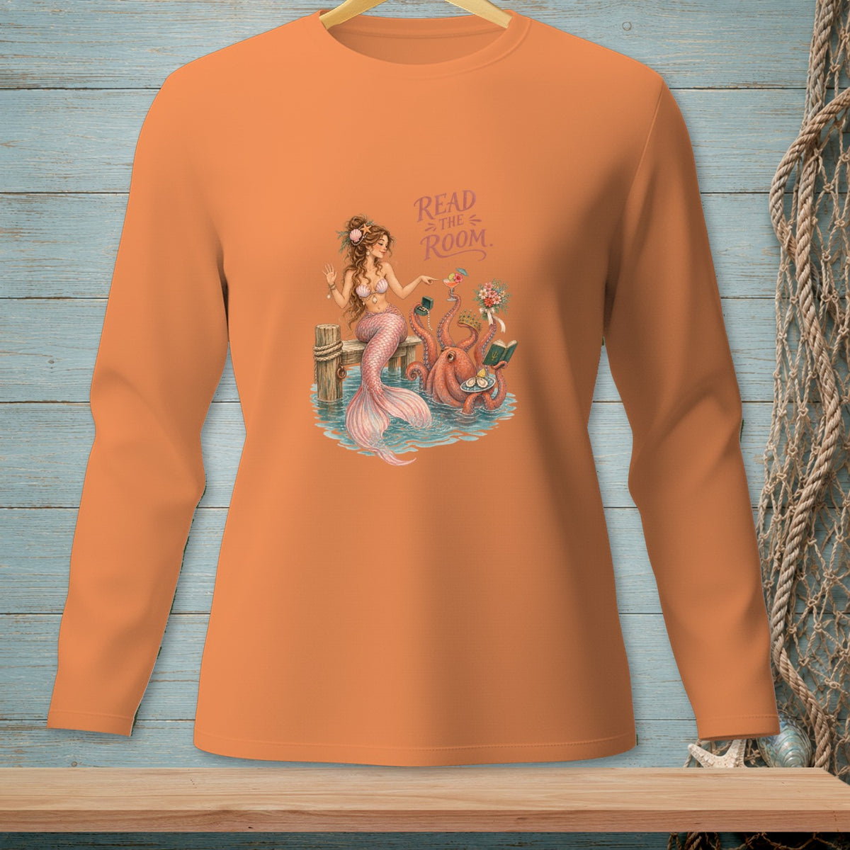 Orange long-sleeve shirt with mermaid and octopus graphic and "Read the Room" text.