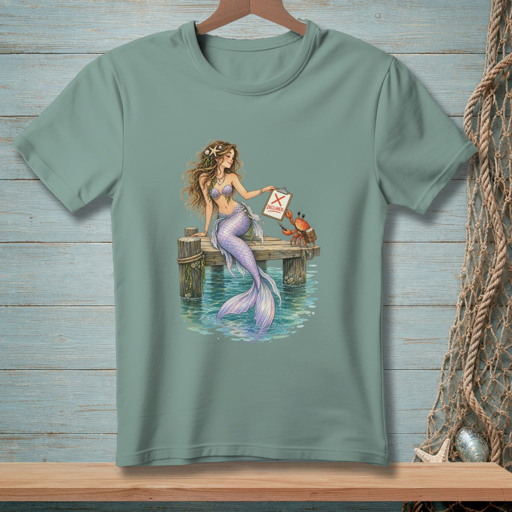 Mermaid on a dock holds clipboard showing "DECLINED" with a crab.