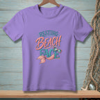 Purple t-shirt with "RESTING BEACH FACE" text and a mermaid tail graphic.