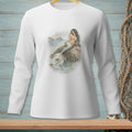 White long-sleeve shirt with a mermaid sitting on a rock in the ocean.