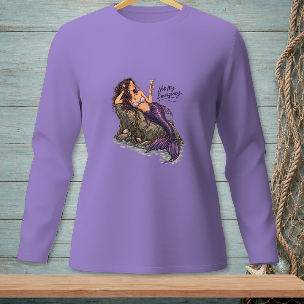 Mermaid with cocktail on rock, text "Not My Emergency" on lavender long-sleeve shirt.