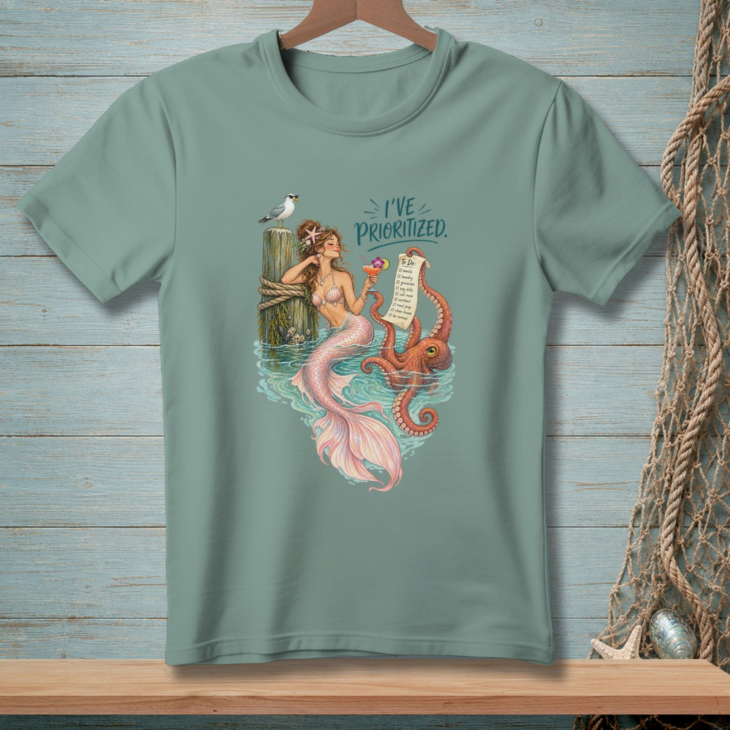 Mermaid with octopus holds cocktail, text reads "I'VE PRIORITIZED" with a to-do list.