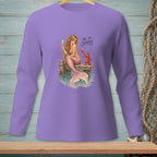 Purple long-sleeve shirt with a mermaid holding a drink and a lobster, text reads "BE SO SERIOUS."