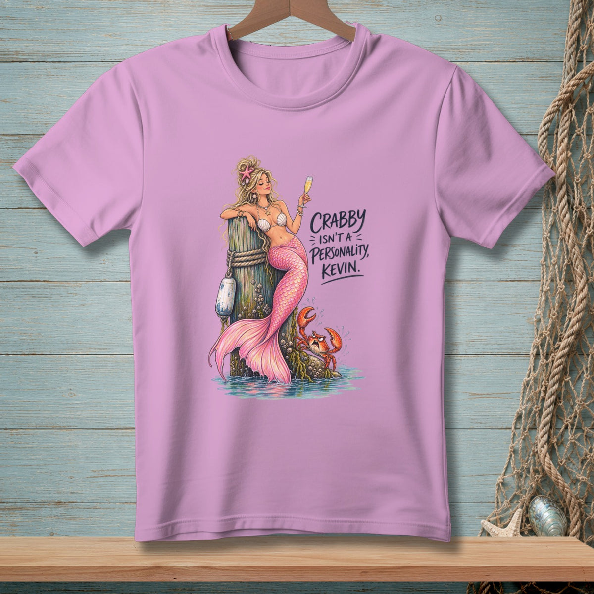 Pink t-shirt with mermaid, crab, and text "Crabby isn't a personality, Kevin."