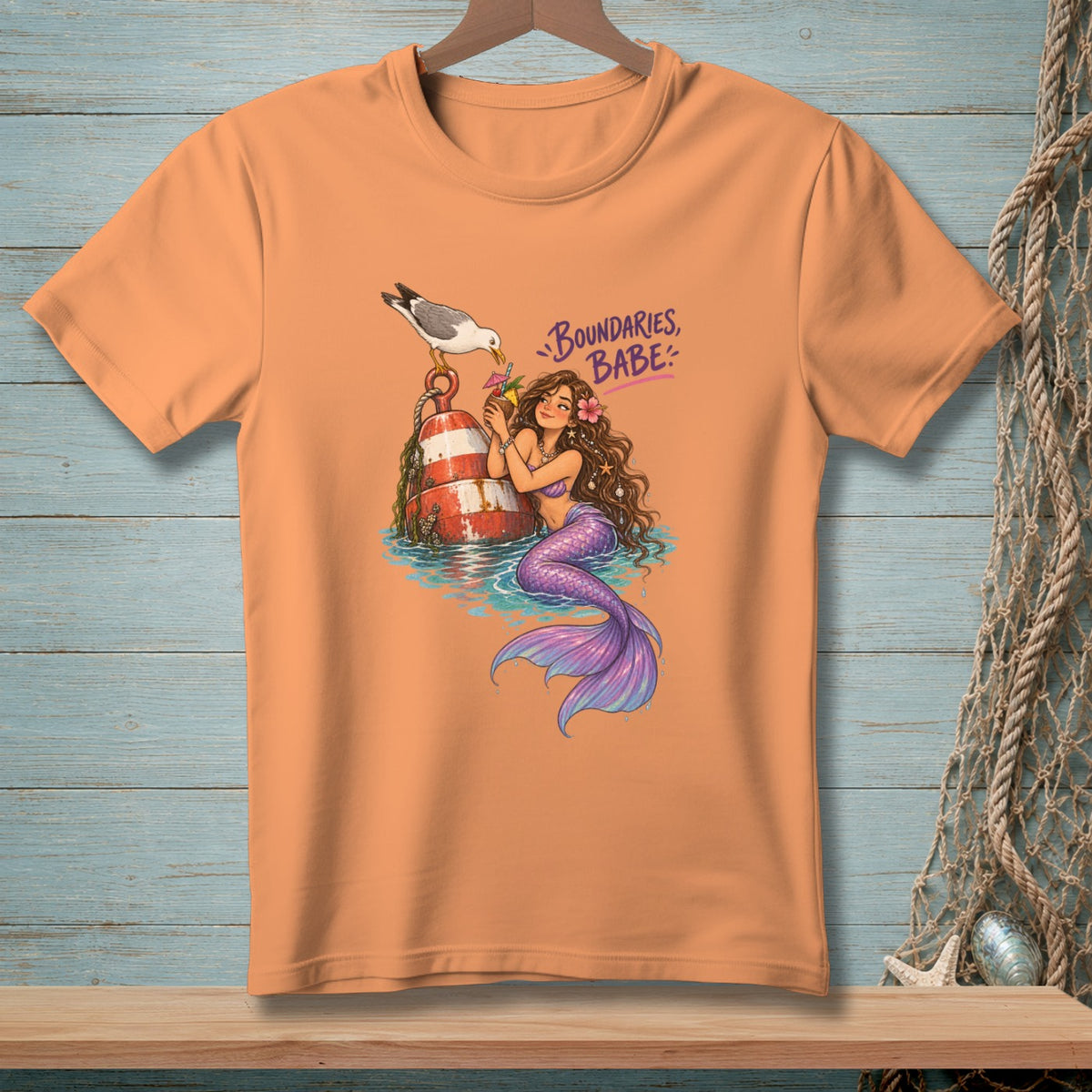 Orange t-shirt with mermaid graphic and text "Boundaries, Babe".
