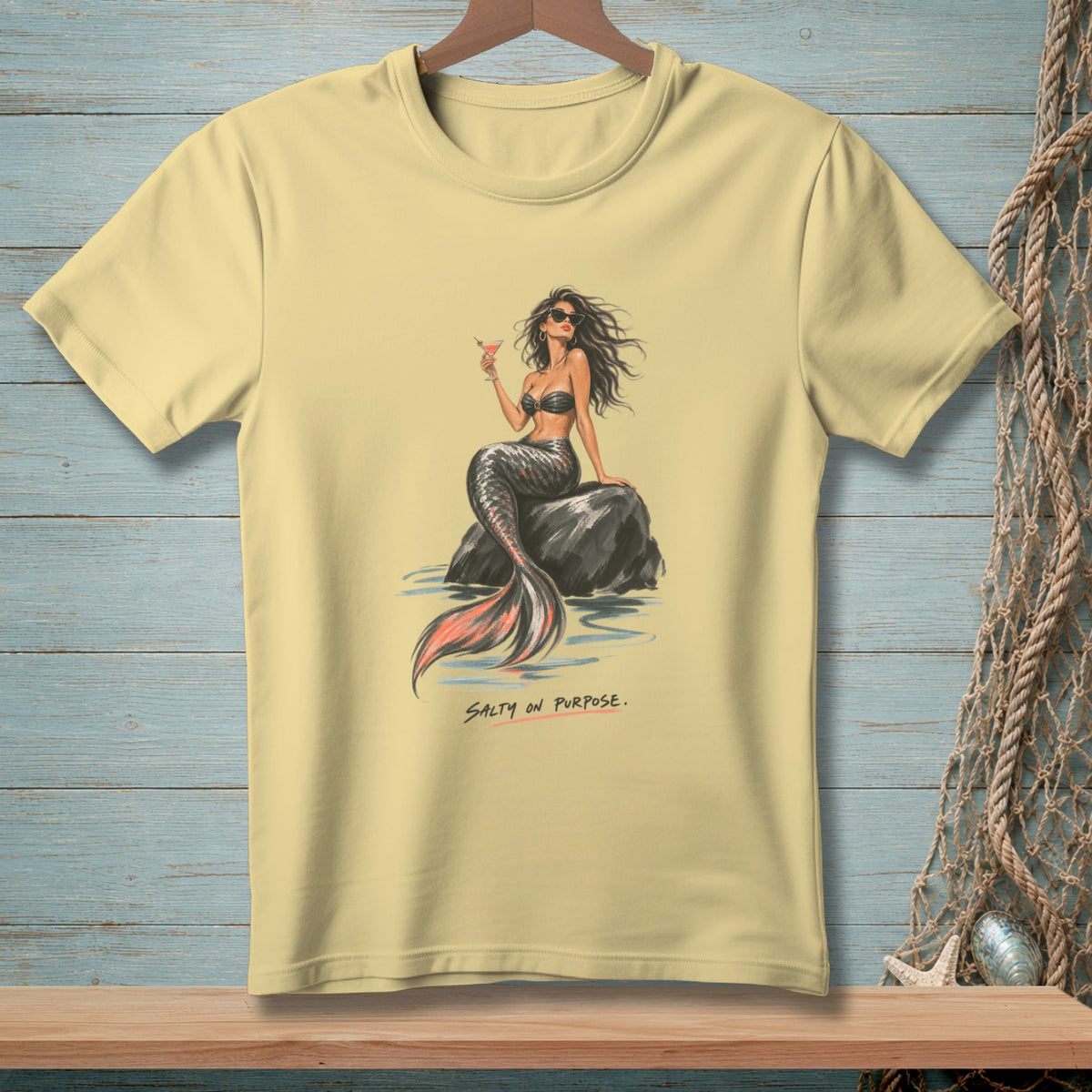 Yellow t-shirt with a mermaid holding a drink, text "SALTY ON PURPOSE."