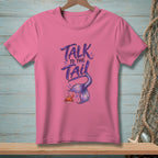 Pink t-shirt with "Talk to the Tail" text and mermaid tail graphic.