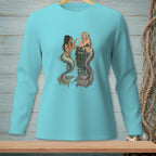 Two mermaids with colorful tails talk beside a wooden post in the water.