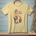 Yellow t-shirt with illustration of a mermaid and lobster with text "Don't Get Comfortable."