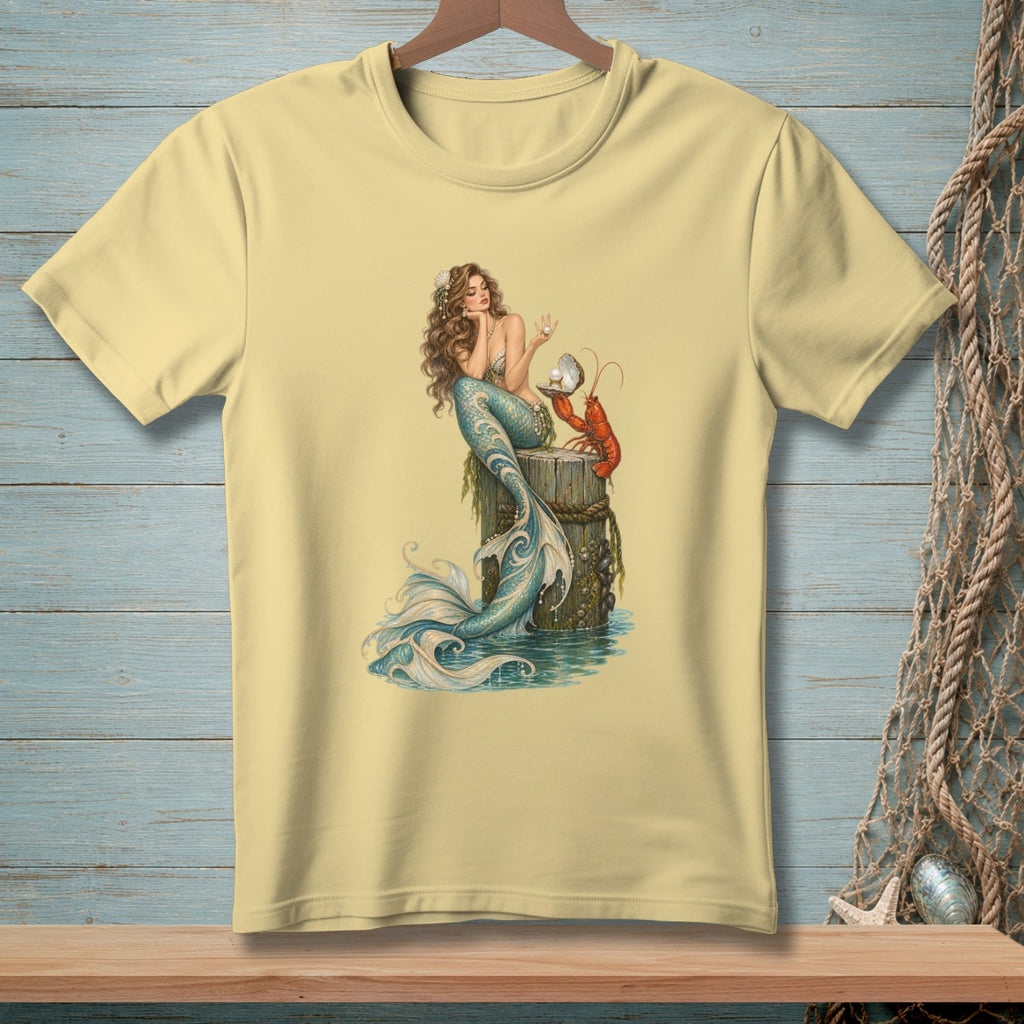 Pale yellow t-shirt featuring a mermaid and lobster illustration with a pearl.
