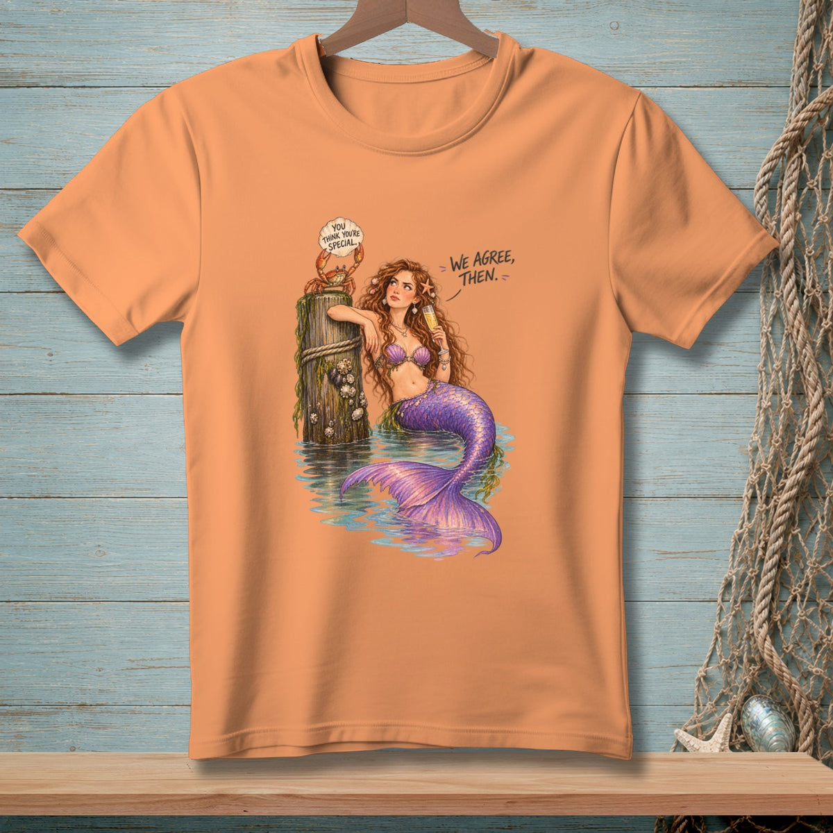 T-shirt graphic of a mermaid and crab with dialogue bubbles reading "You think you're special." and "We agree, then."