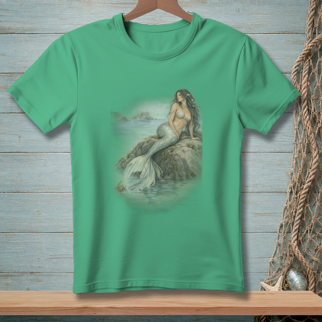 T-shirt with a mermaid sitting on a rock in the ocean.