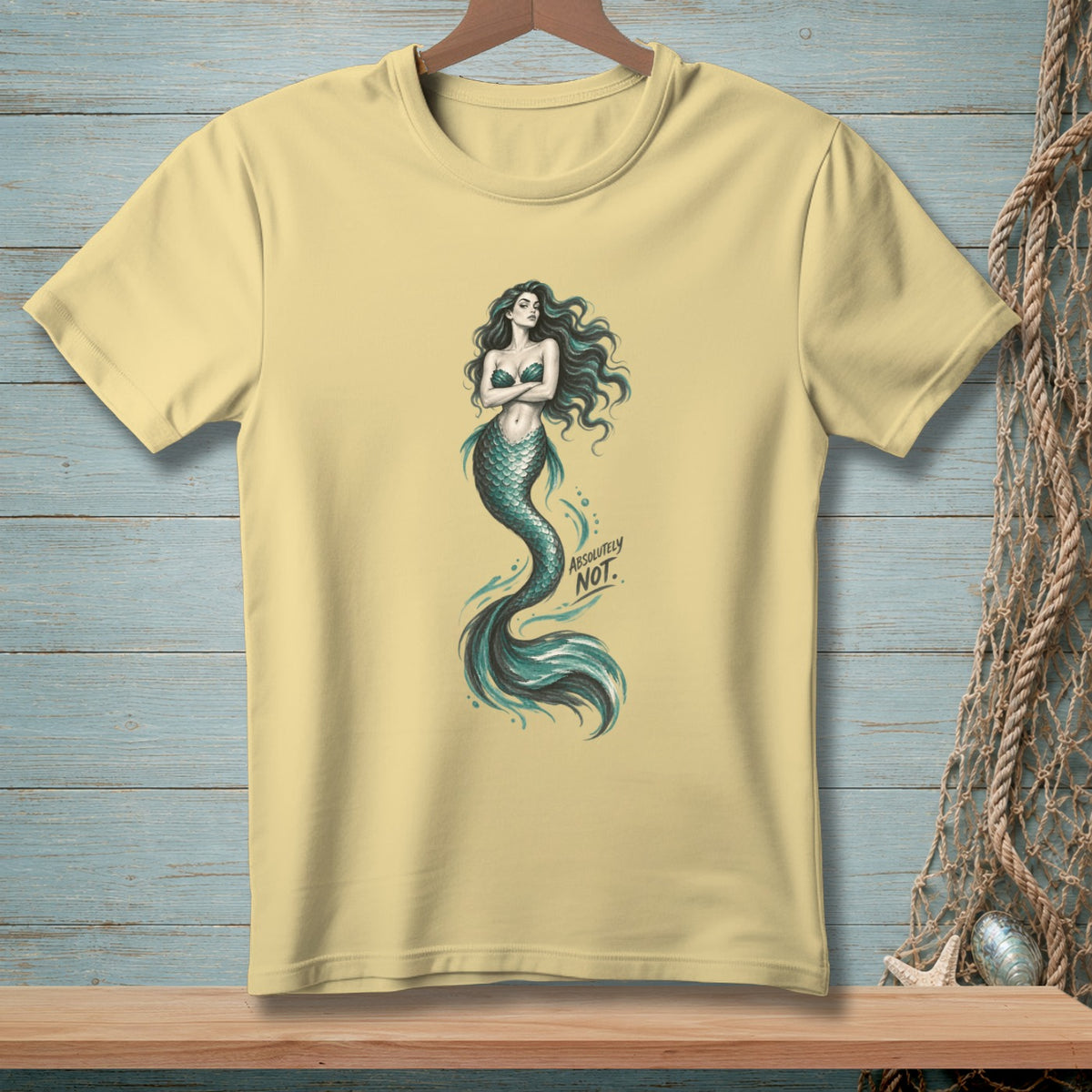 Yellow t-shirt with a mermaid graphic and the text "ABSOLUTELY NOT."