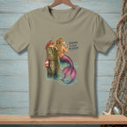 Mermaid with lobster on pier, drinking wine. Text reads "SILENCE IS ALSO AN ANSWER."