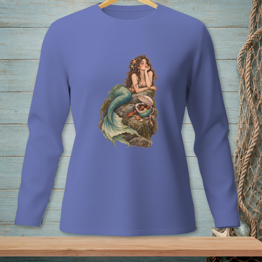Purple long sleeve shirt with a mermaid illustration on a rock.
