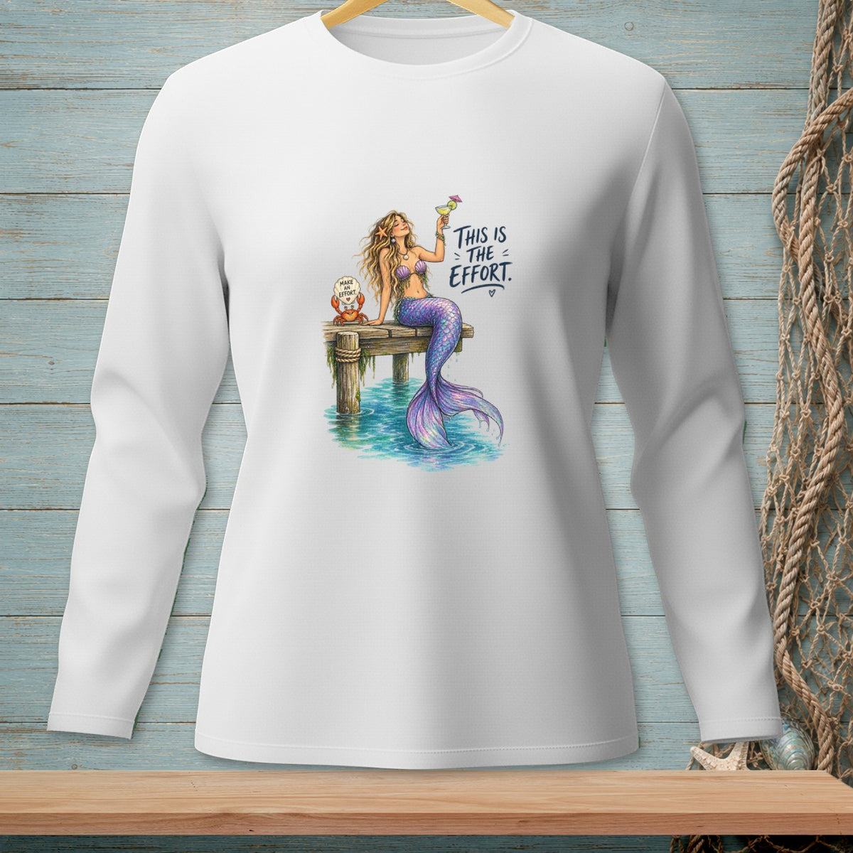 Mermaid with drink and crab on dock with text "This is the effort."
