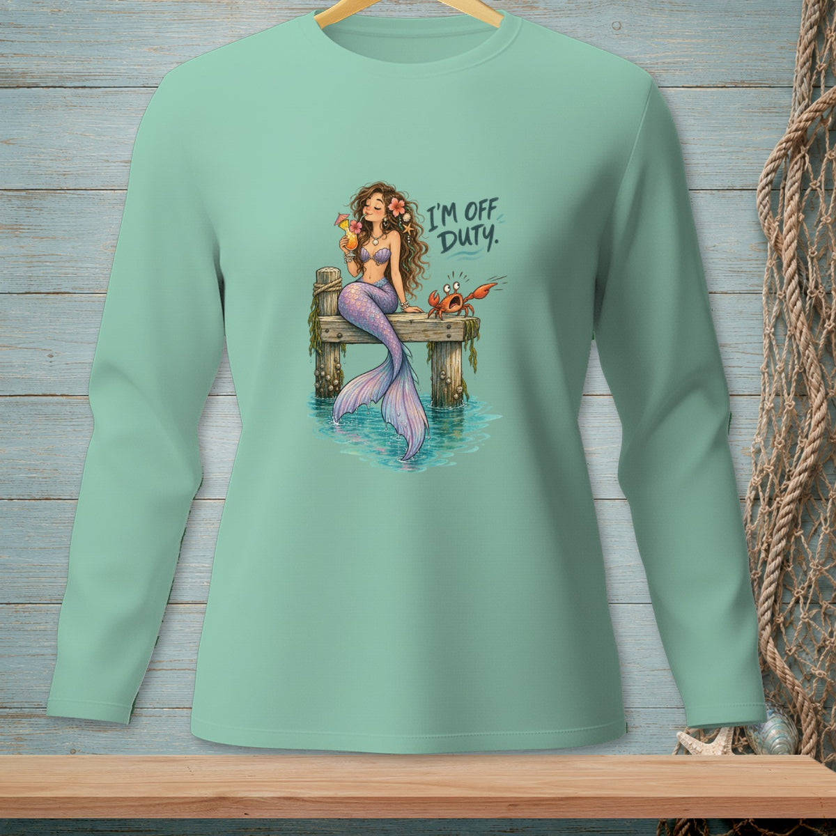 Mermaid with cocktail and crab on a dock, text "I'M OFF DUTY."