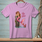 Pink t-shirt with a mermaid sitting on a post, a lobster, and text.