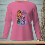 Pink long sleeve shirt featuring a mermaid on a dock with the text "Salty, Tangled & Unbothered."