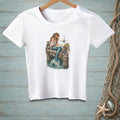 White t-shirt with a mermaid reading on a dock with sailboats in the background.