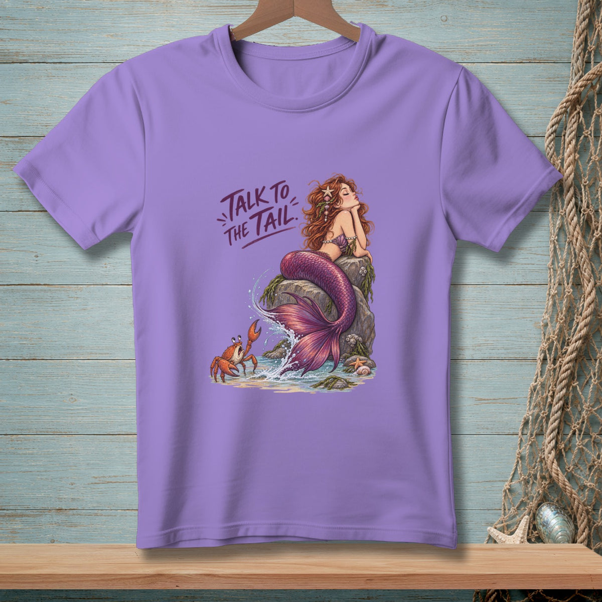 Purple t-shirt with mermaid and crab graphic, reads "Talk to the Tail".