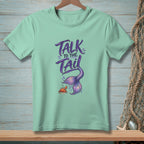 Mint t-shirt with "Talk to the Tail" text and mermaid tail illustration.
