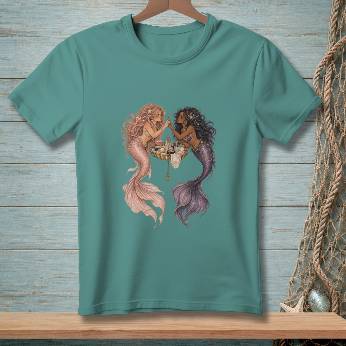 Two mermaids with makeup and accessories on a tray.