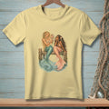Two mermaids with colorful tails sit on a wooden dock looking into a mirror.